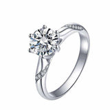 0.8 CTW colorless round brilliant cut moissanite solitaire engagement ring in sterling silver with pave set accent stones