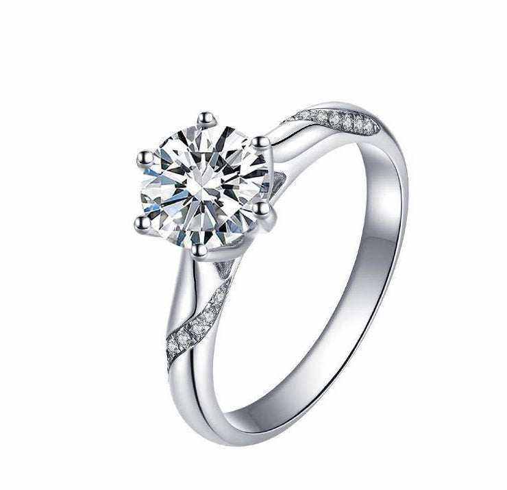 0.8 CTW colorless round brilliant cut moissanite solitaire engagement ring in sterling silver with pave set accent stones