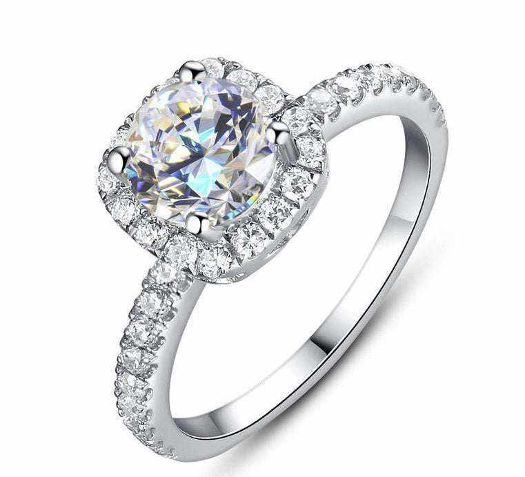 0.5 CTW DEW colorless round brilliant cut moissanite halo engagement ring in sterling silver with pavé cubic zirconia accents