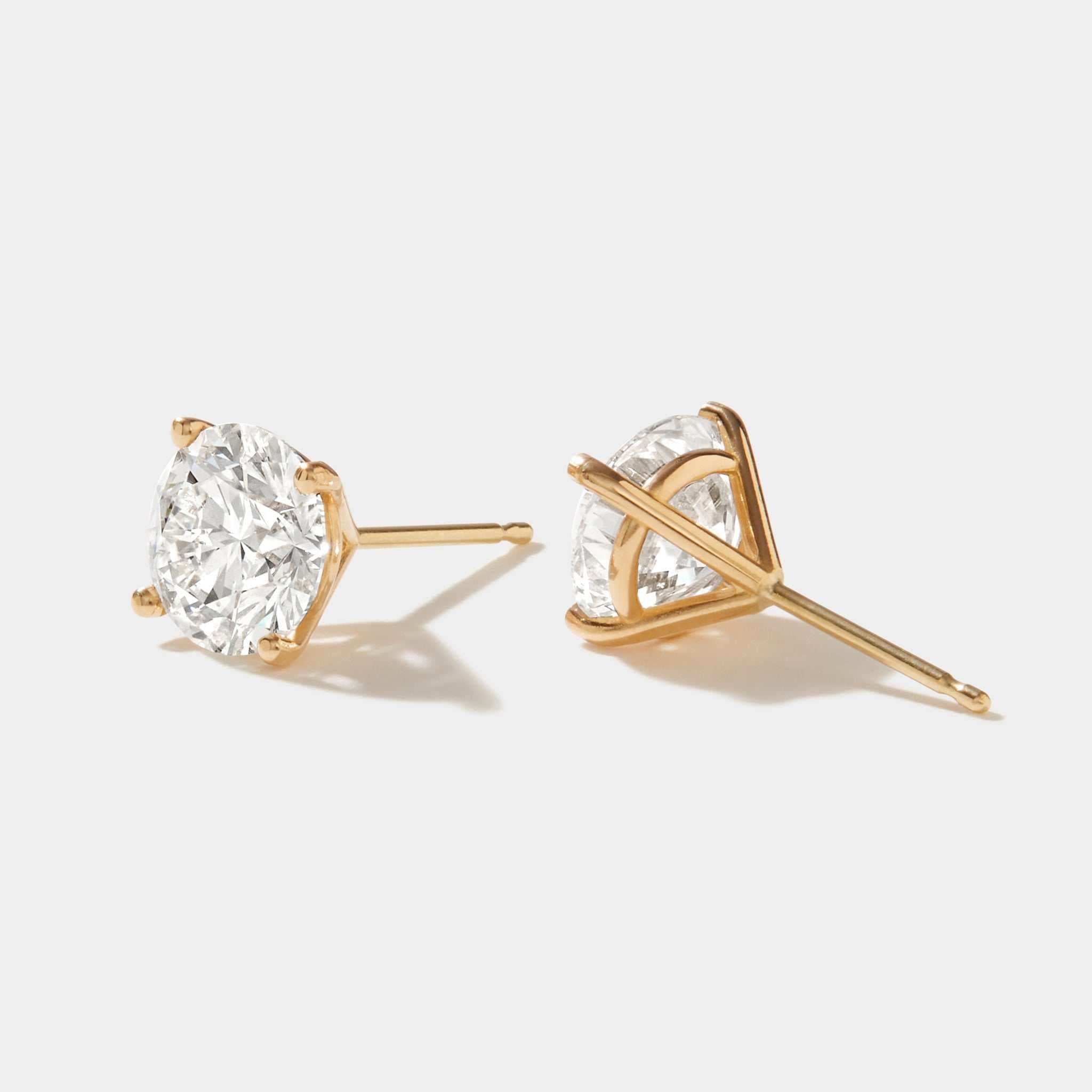 3 carat lab grown diamond stud earrings set in 14k gold four-prong martini setting
