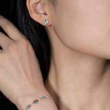 Emerald Cut Blue Topaz Stud Earrings in 14K Yellow Gold