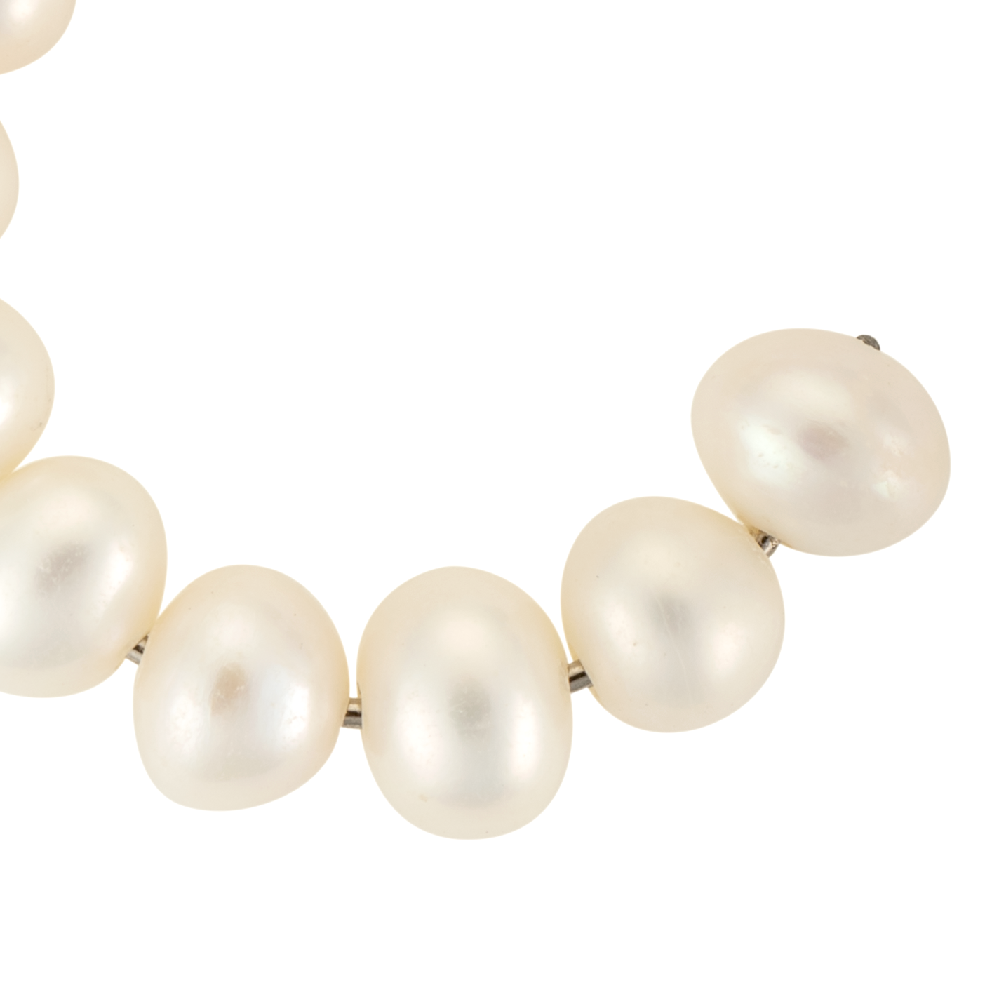 Close-up of stacked white freshwater cultured pearl hoop earrings with 3-4mm pearls on 1-inch hoops, available in gold or silver.