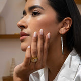 Woman wearing Miladi large oxidized silver long dangling earrings with raw uncut diamonds