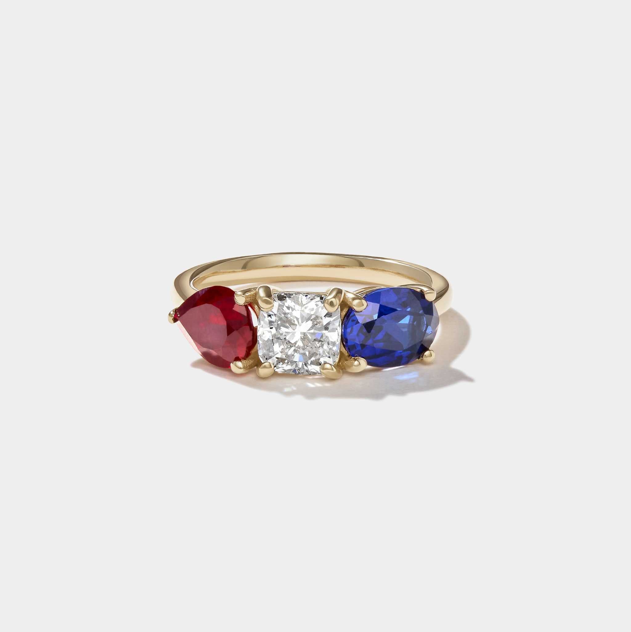 Americana Signature Three-Stone Ring with lab-grown ruby, cushion-cut diamond, and sapphire in 14k yellow gold