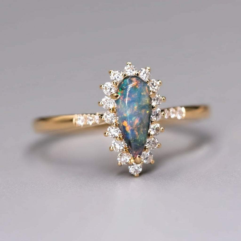 18K yellow gold engagement ring with Australian black opal and halo diamonds