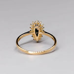 18K yellow gold engagement ring with Australian Black Opal and halo diamond setting