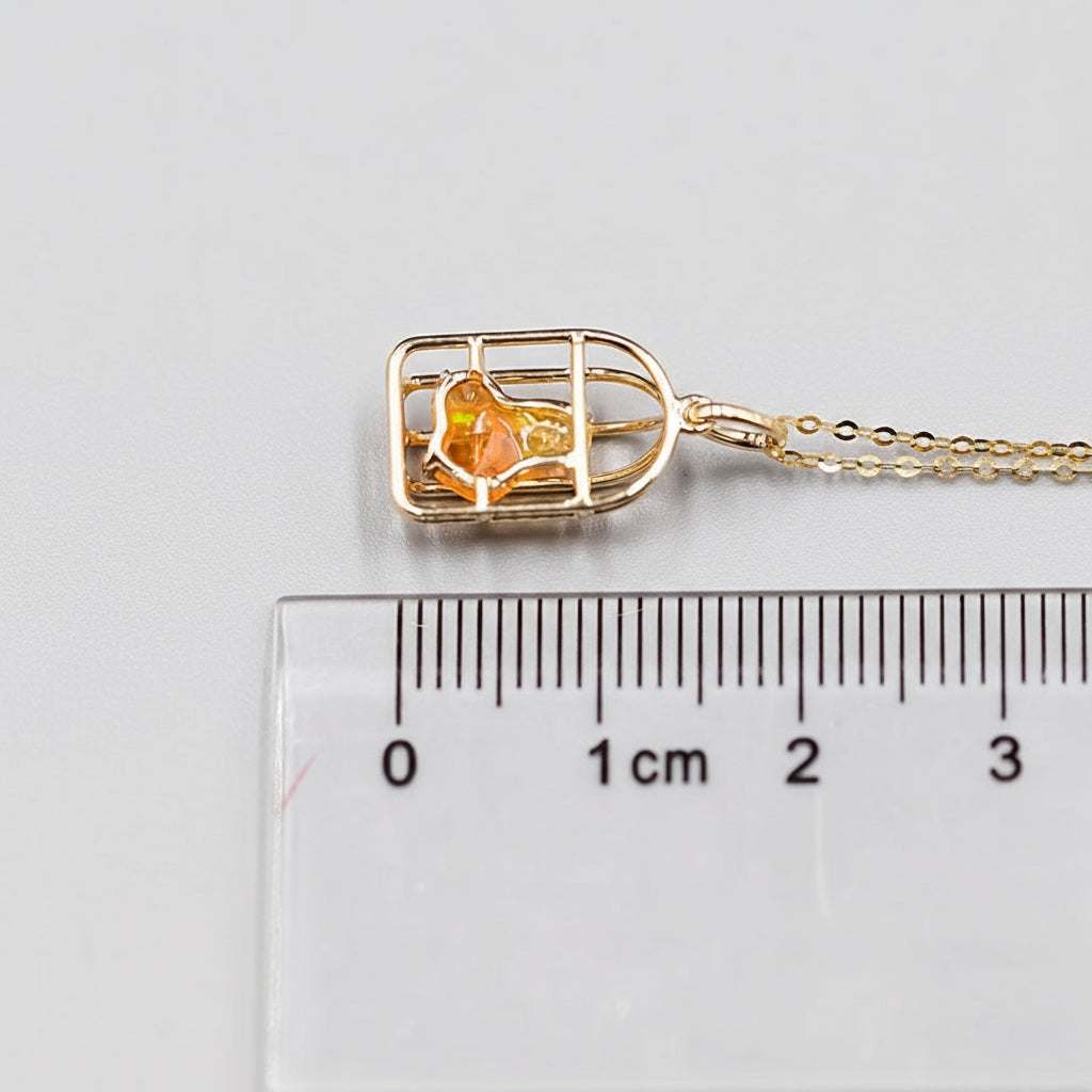 Bird cage Mexican fire opal necklace pendant in 14K yellow gold with 0.66 ct orange opal