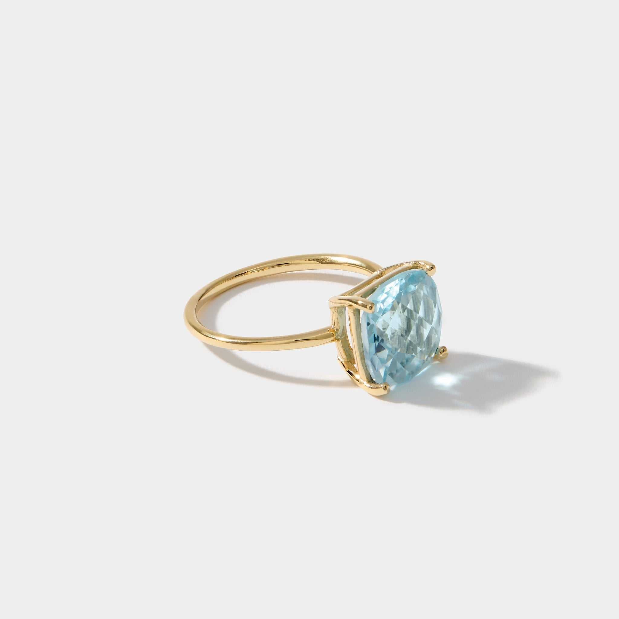 14k gold ring with cushion cut sky light blue topaz gemstone