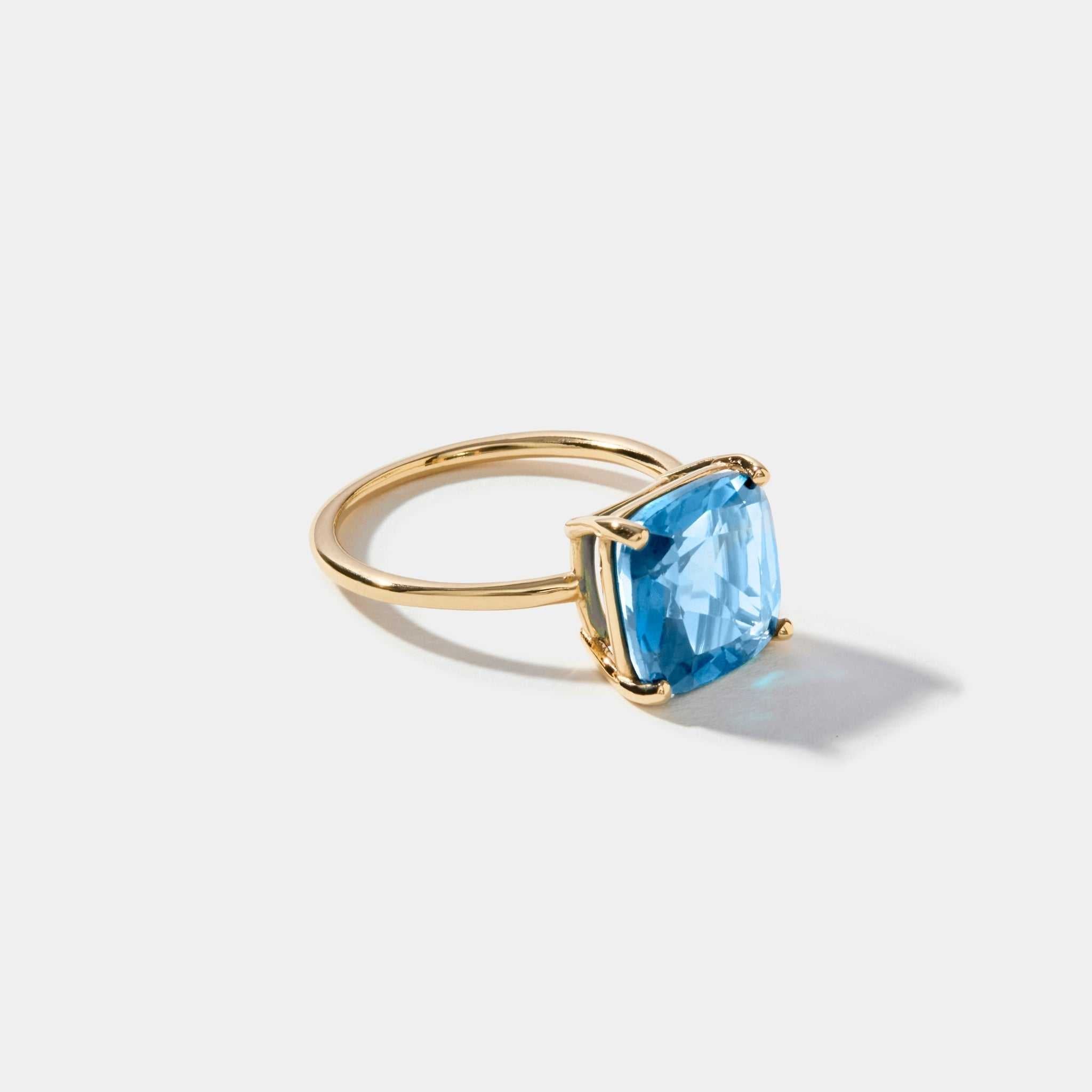 14k gold ring with cushion cut sky light blue topaz gemstone