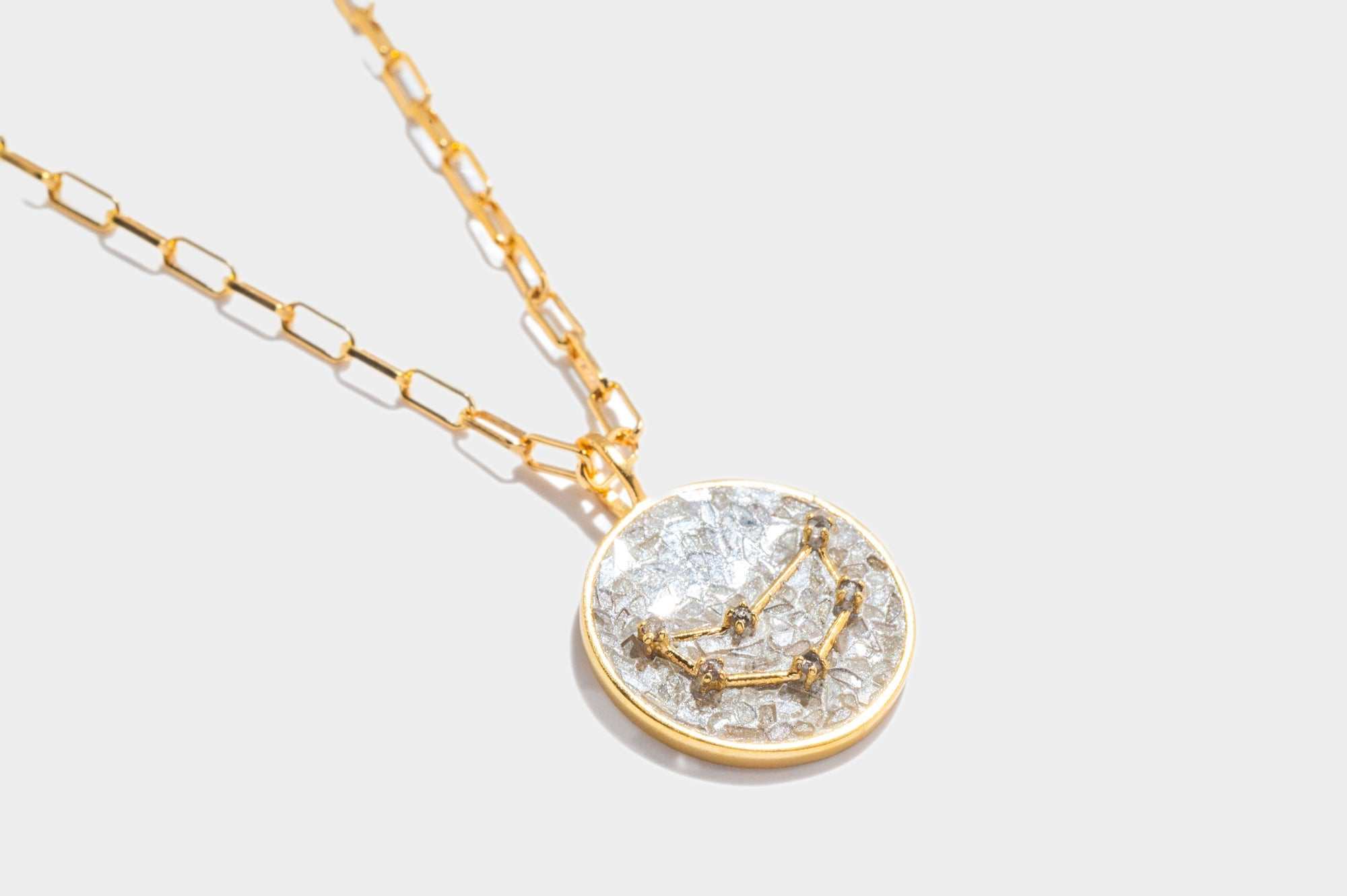 Capricorn gold vermeil pendant necklace with raw and rose cut diamonds on an 18k gold chain