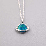 Earth Moon Doublet Opal and diamond pendant in 18K white gold with blue and green opal colors