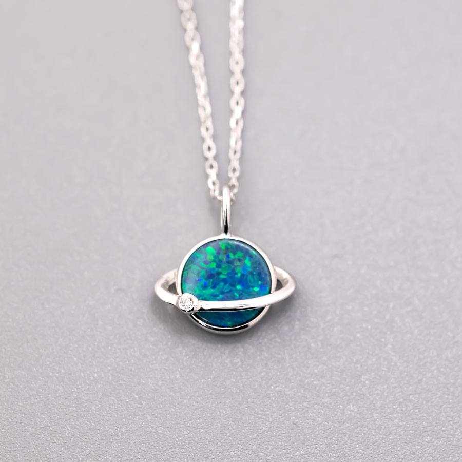 Earth Moon Doublet Opal and diamond pendant in 18K white gold with blue and green opal colors