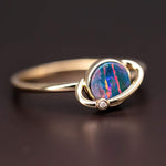 18K yellow gold Earth and Moon Doublet Opal ring with diamond and vibrant red, green, and orange opal colors