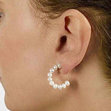 Stacked Pearl Hoops earrings with white freshwater cultured pearls on pierced ear