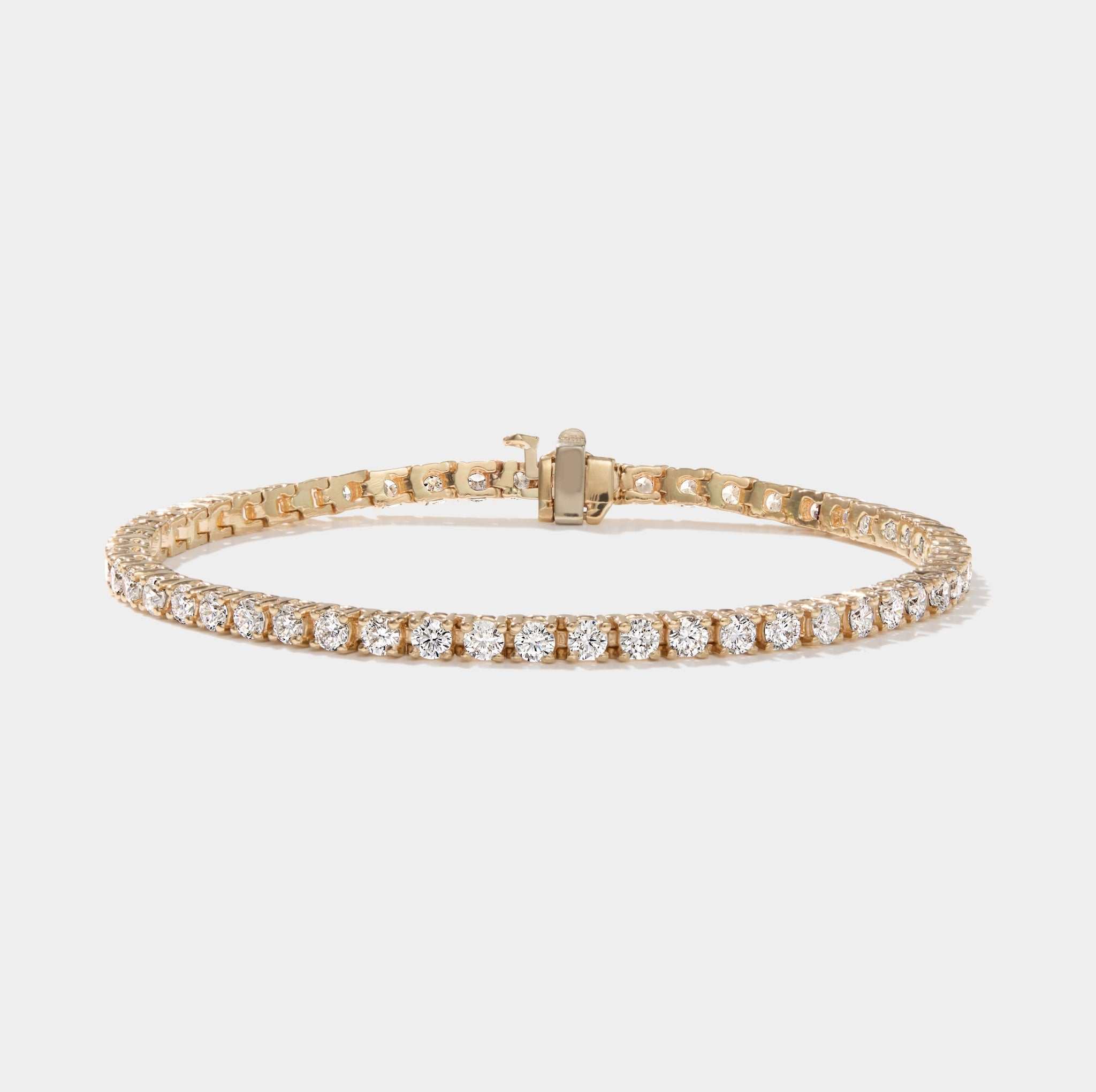 5 carat lab grown diamond tennis bracelet in 14k yellow gold with four-prong setting, made in the USA