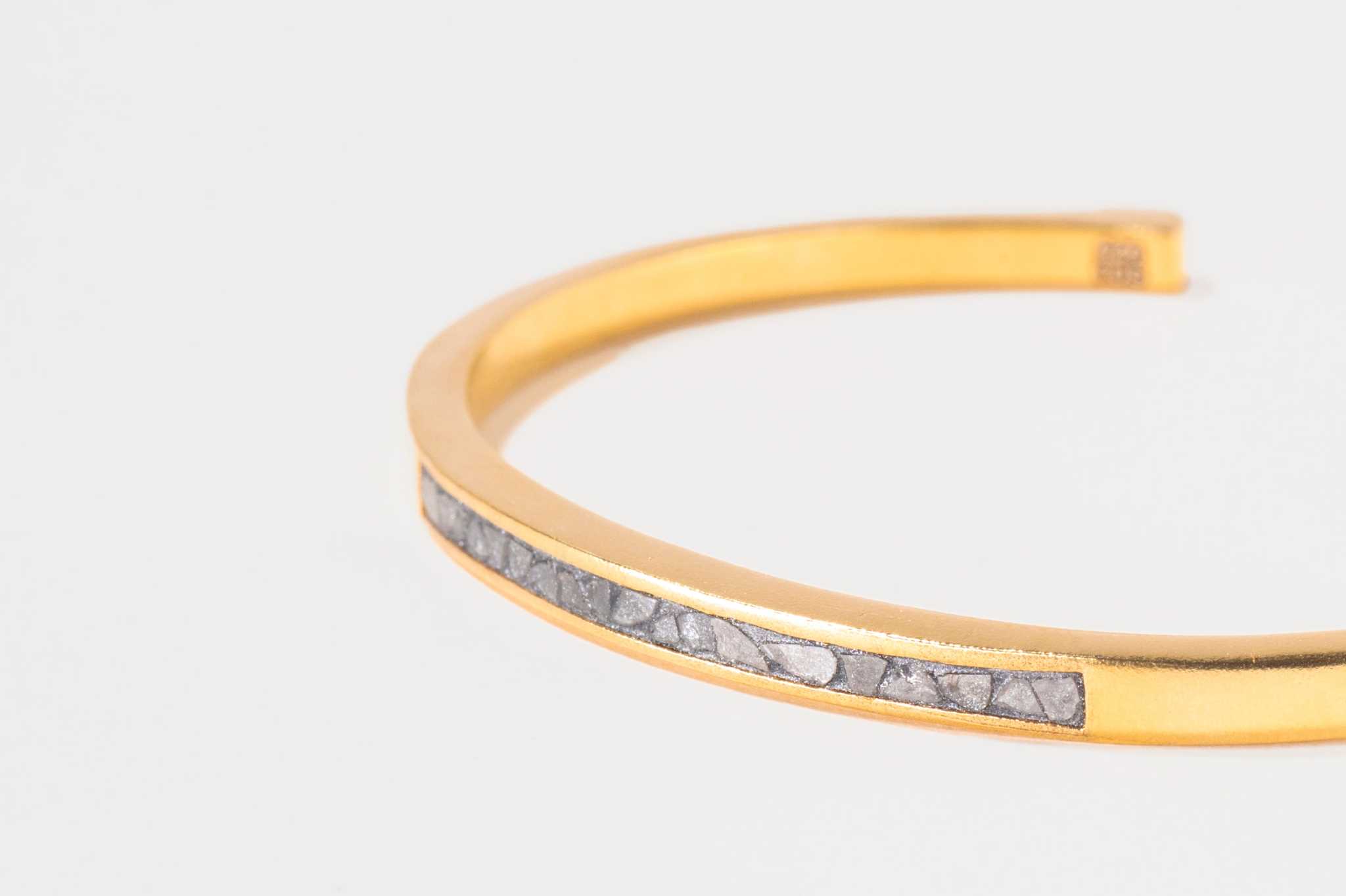 Slim Hapur Gold Vermeil Bangle with embedded raw diamond pieces on a gold band