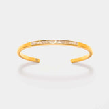 Hapur Gold Vermeil Bangle bracelet with a slim design featuring raw uncut diamonds and 18K gold layered vermeil on sterling silver.