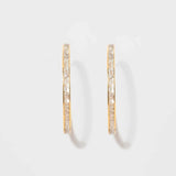 Pair of Hapur Gold Vermeil Hoop Earrings with sliced raw uncut diamonds and 18K gold layer on sterling silver base.