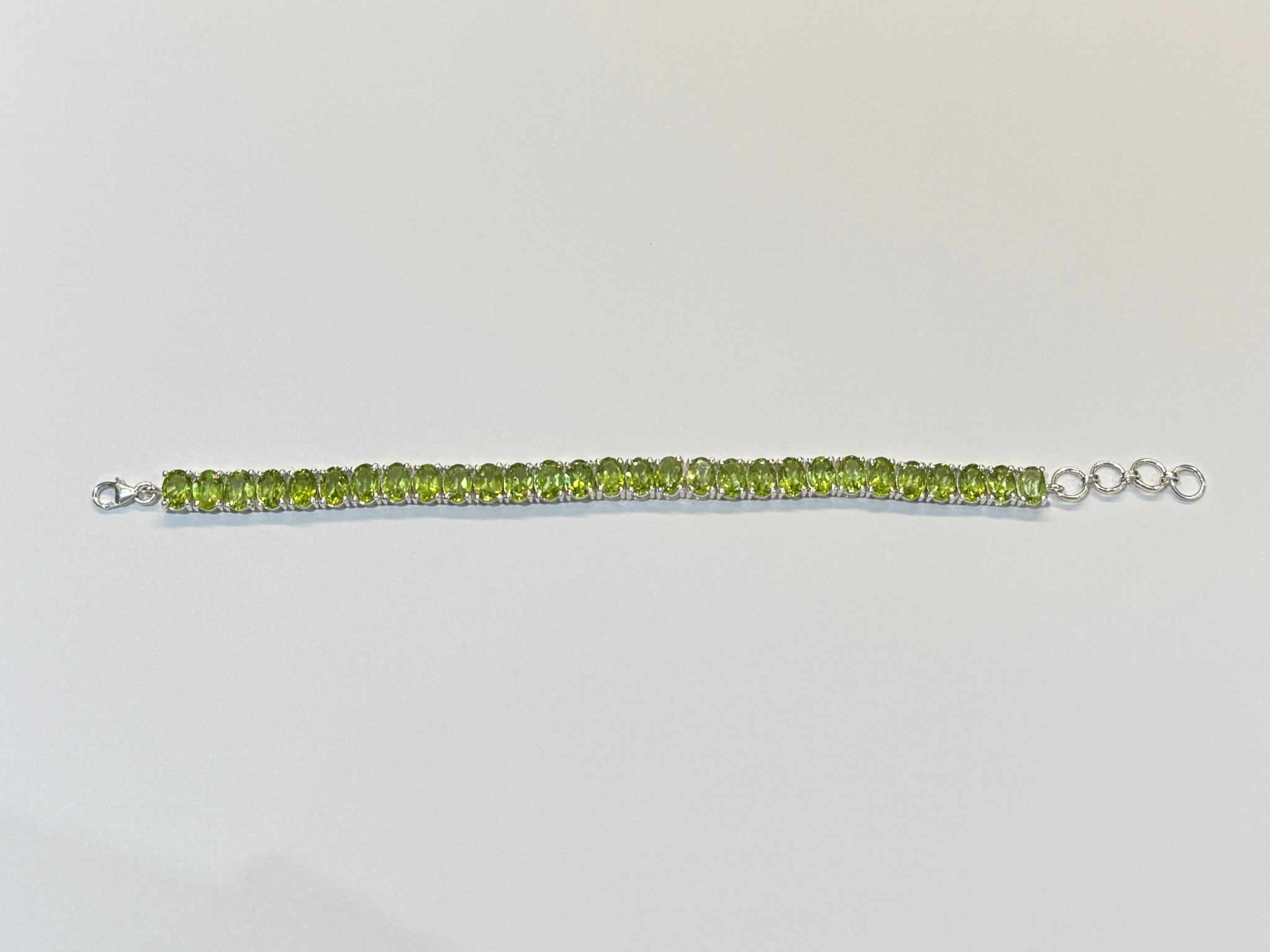 27.55 CTW 7x5mm Oval Faceted Cut Natural Green Peridot 925 Sterling Si