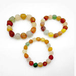 Three elastic beaded bracelets featuring large natural Alashan Gobi Desert Candy Agate chalcedony stones in various colorful, rough, and translucent shapes.