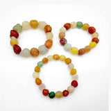 Three elastic beaded bracelets featuring large natural Alashan Gobi Desert Candy Agate chalcedony stones in various colorful, rough, and translucent shapes.