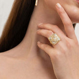 Miladi Small Gold Vermeil Earrings with raw uncut diamonds, long geometric dangling design, worn on ear.