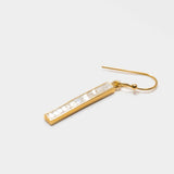 Miladi small gold vermeil earring with rectangular bar featuring raw uncut diamonds and 18k gold finish.