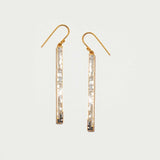Pair of Madeline Gold Vermeil long dangling earrings with raw sliced diamonds and pave diamond accents