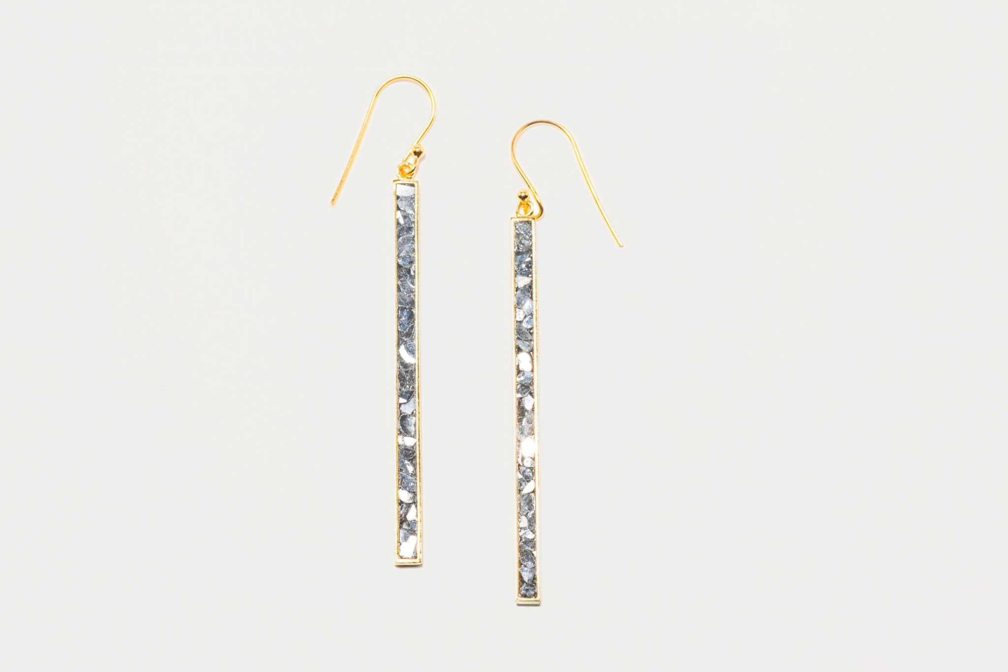 Miladi large gold vermeil earrings with long, geometric design and raw uncut diamonds in silver resin