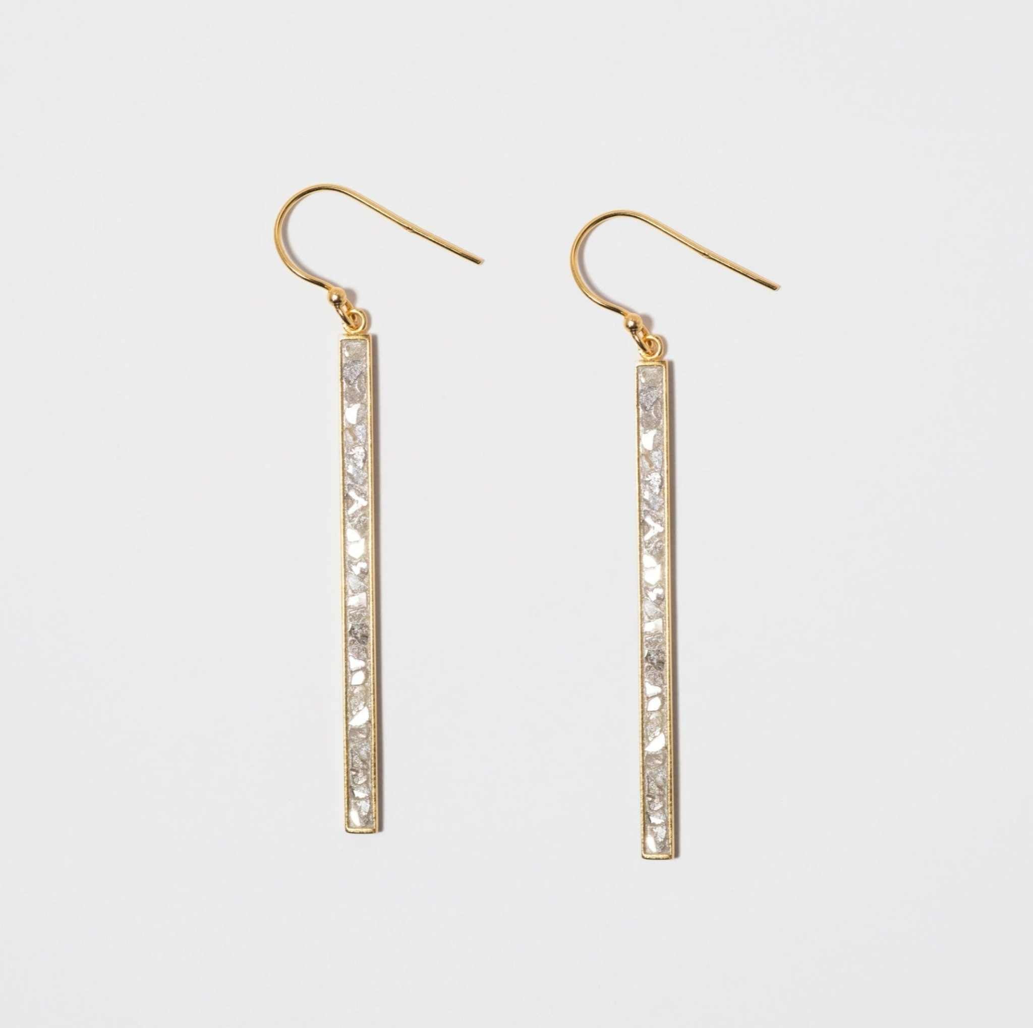 Miladi Large Gold Vermeil Earrings featuring long, geometric gold bars with raw uncut diamonds and sterling silver resin accents.