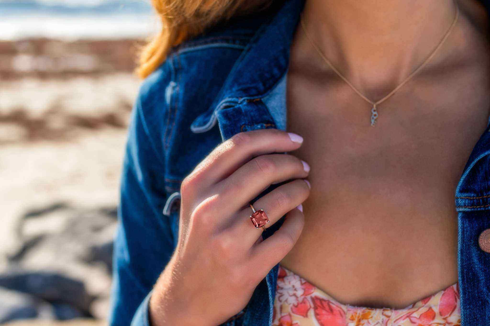 Boston Red Ring featuring 14k gold and cushion cut lab-grown ruby worn on hand
