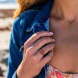 Boston Red Ring featuring 14k gold and cushion cut lab-grown ruby worn on hand