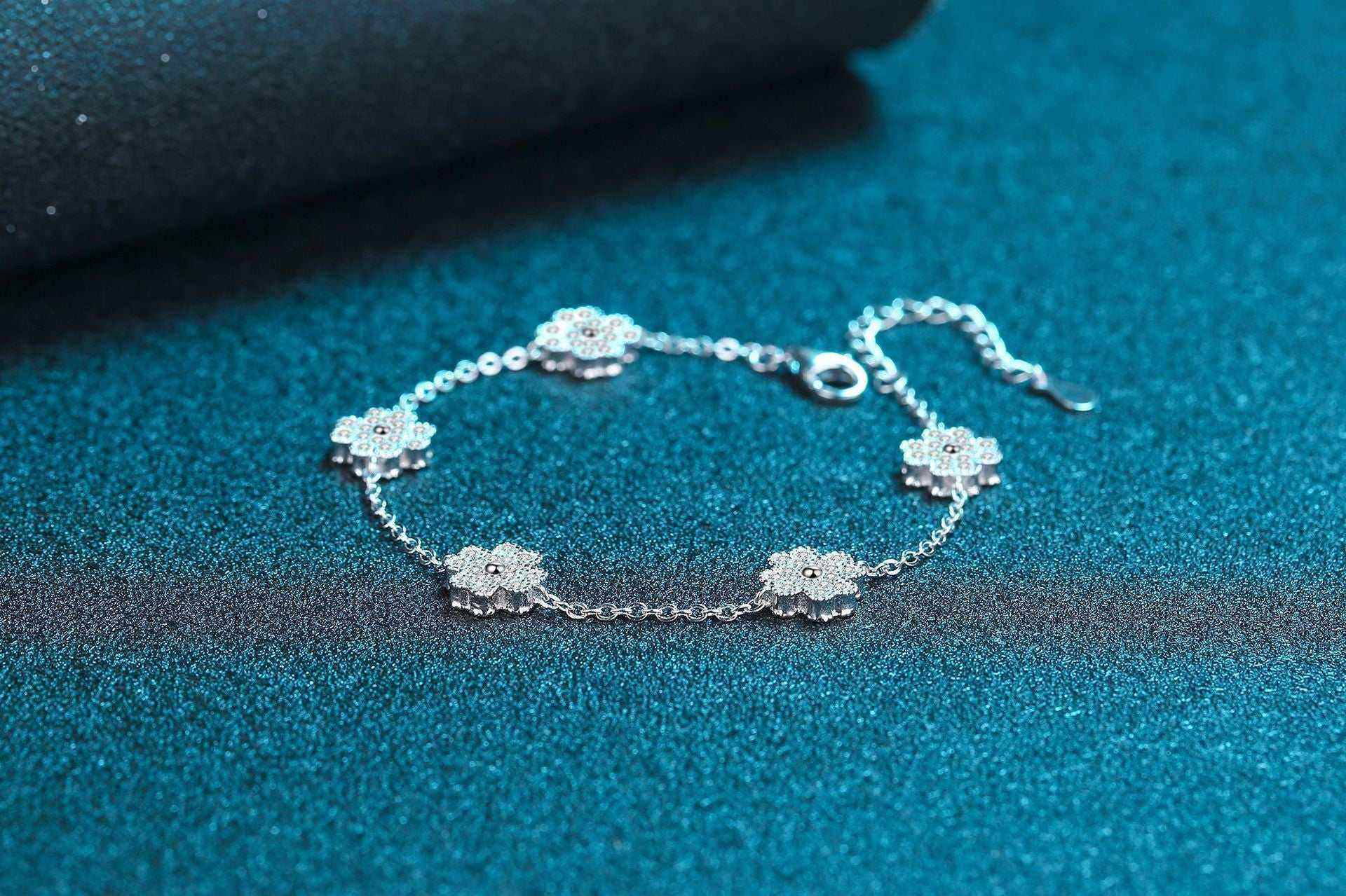 Adjustable 0.64 CTW colorless moissanite lucky clover freesia flower bracelet in 925 sterling silver rolo chain