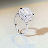 5 CTW colorless cushion cut moissanite halo engagement ring in sterling silver with pavé cubic zirconia accents