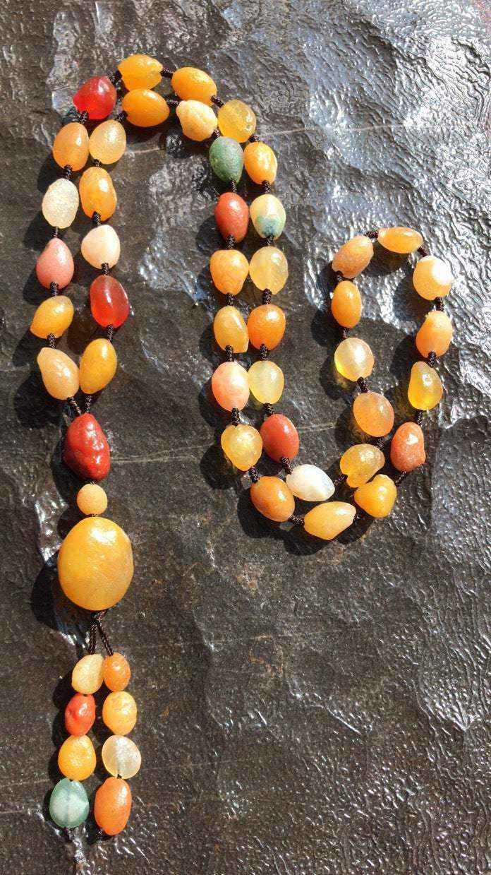 Alashan Gobi Desert Agate necklace with multi-color rough beads and large pendant on brown rope strand