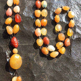 Alashan Gobi Desert Agate necklace with multi-color rough beads and large pendant on brown rope strand