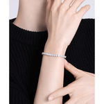 3.5 CTW colorless round brilliant cut moissanite tennis bracelet in adjustable bolo style set in 925 sterling silver worn on wrist