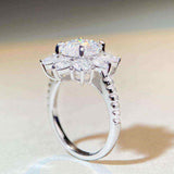 2.4 CTW DEW cushion cut moissanite sunflower halo engagement ring in sterling silver with pavé cubic zirconia accents