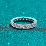 2.1 CTW DEW moissanite eternity wedding band in platinum plated sterling silver with round brilliant cut stones