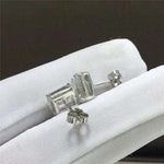 Pair of 1.05 CTW colorless emerald cut rectangular moissanite halo stud earrings in 925 sterling silver with push back closures