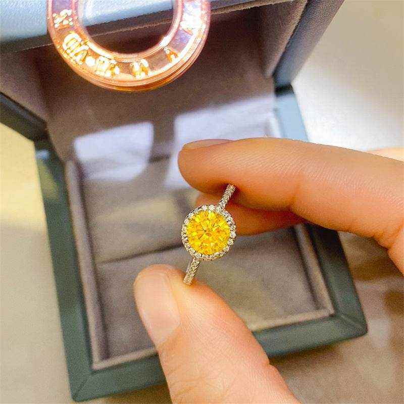 4.75 carat round brilliant cut fancy yellow moissanite halo engagement ring in sterling silver with pavé outline