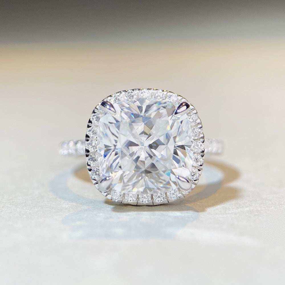 5 CTW colorless cushion cut moissanite engagement ring with sterling silver pavé halo setting