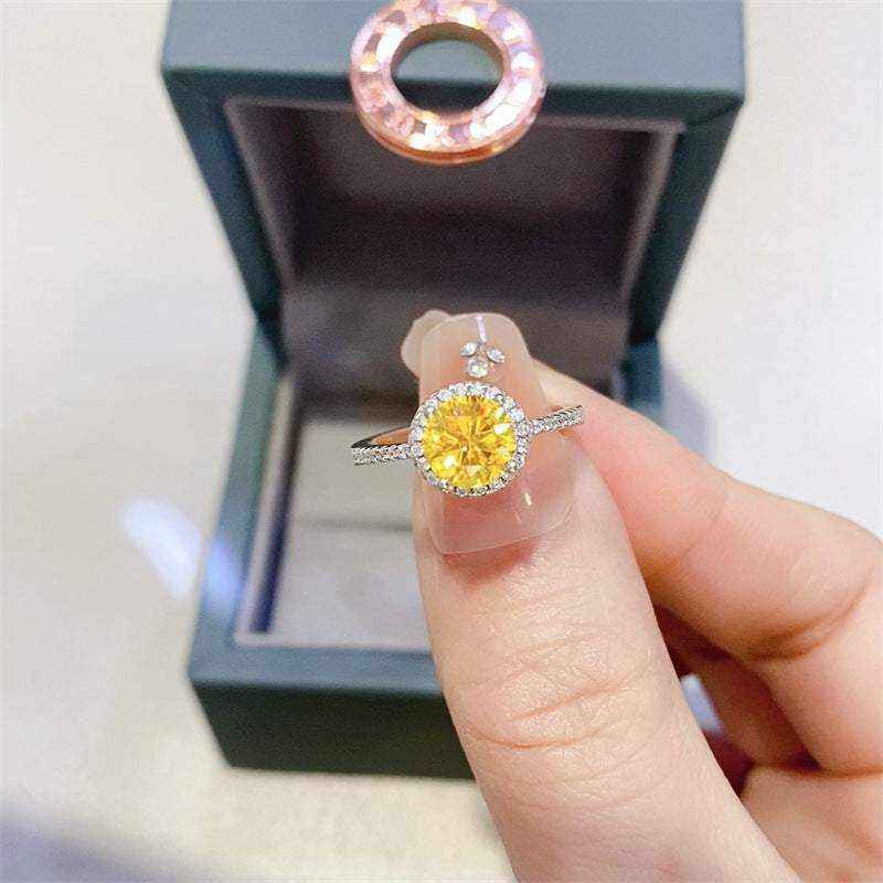 4.75 carat yellow moissanite halo engagement ring in sterling silver with pavé outline sparkling white stones