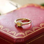 18K yellow gold twisted ring with square cube sugar gem on red decorative box