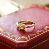 18K yellow gold twisted ring with square cube sugar gem on red decorative box