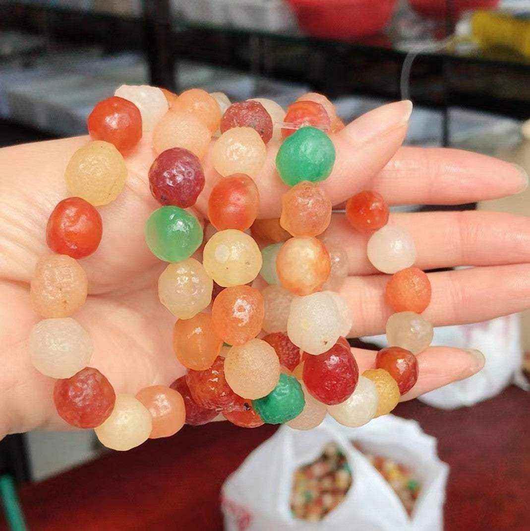Colorful large-sized rough stone elastic bead bracelet made of natural Alashan Gobi Desert Candy Agate with waxy translucence in various vibrant hues.
