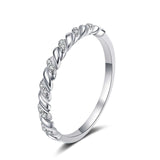 Micro pave croissant shaped moissanite ring in platinum plated S925 sterling silver with 14 round colorless stones and twisted braid design