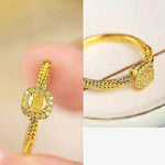 18K yellow gold twisted ring with square cube sugar zircon gem and polished finish
