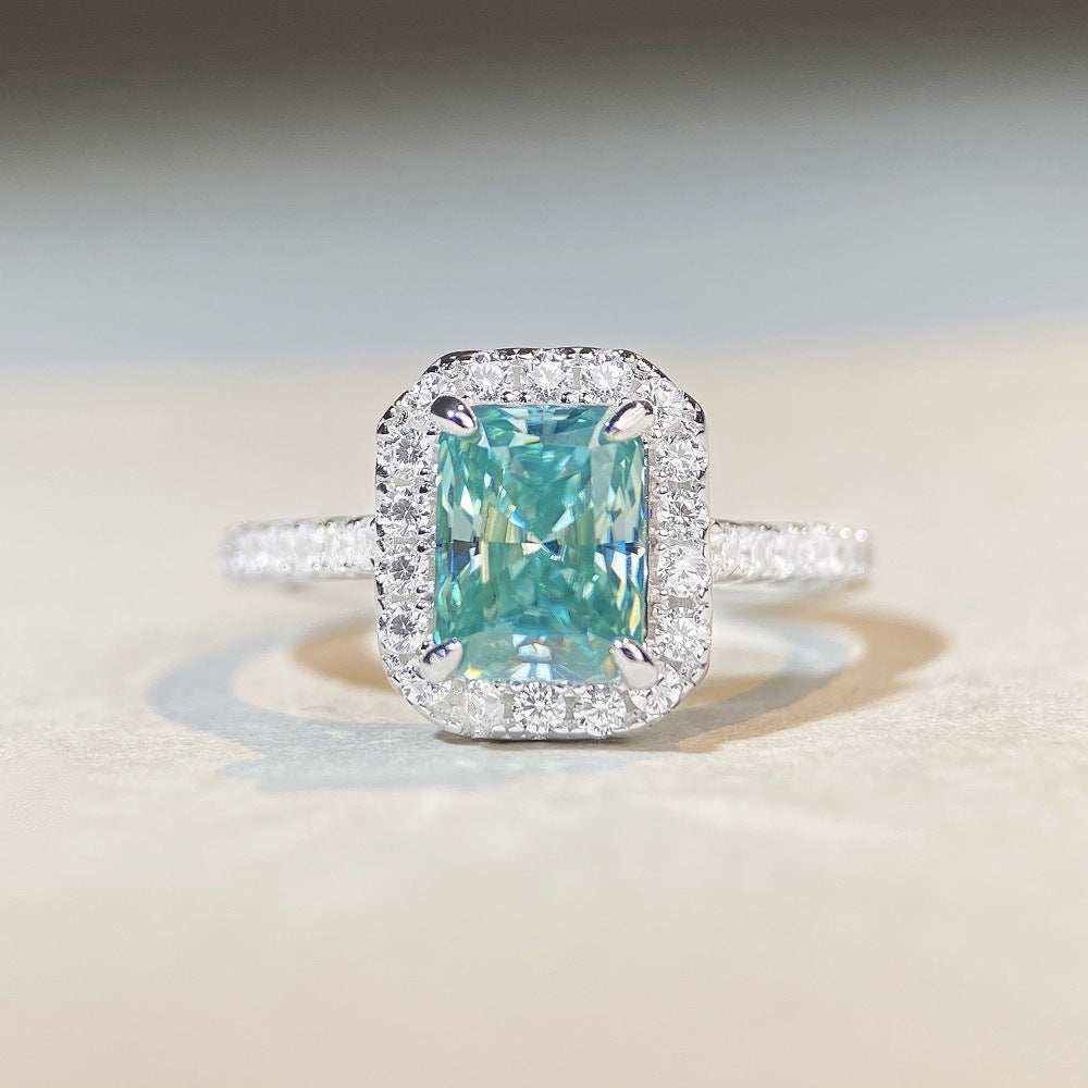 1.8 CTW DEW Radiant Cut Paraíba Mint Green moissanite halo engagement ring in sterling silver with pavé diamonds