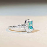 1.8 CTW DEW Radiant Cut Paraíba Mint Green moissanite halo engagement ring in sterling silver